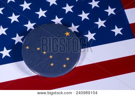 London, Uk - April 27th 2018: The Symbol Of The State Of Alaska, Pictured Over The Flag Of The Unite