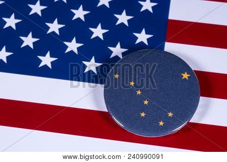 London, Uk - April 27th 2018: The Symbol Of The State Of Alaska, Pictured Over The Flag Of The Unite