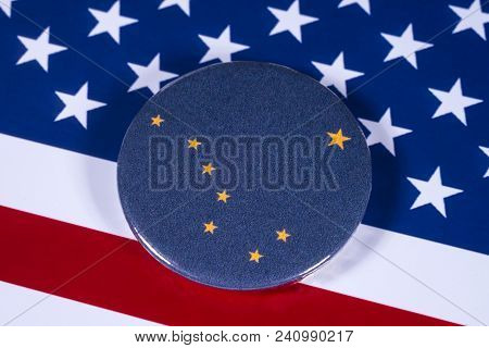 London, Uk - April 27th 2018: The Symbol Of The State Of Alaska, Pictured Over The Flag Of The Unite