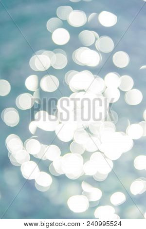 Colorful Twinkling Beach Reflect Bokeh Light Background.