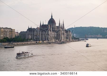 View Of Historical Building Of Hungarian Parliament And Chain Bridge On Danube River In Budapest, Hu