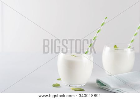 Organic Probiotic Kefir Drink Or Youghurt (ayran, Lassi) In Glasses With Herbs On  Gray Background, 