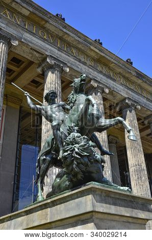 Berlin, Germany - 09 May 2013: The Statue Fighter With A Lion Architect Albert Wolff Against The Bac