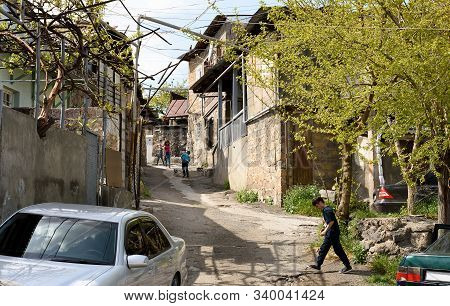 Yerevan, Armenia-april, 28 2019: Locals On Street Of Poor Residential District In Center Of Yerevan,