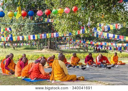 Lumbini, Nepal - November 09, 2019: Monks In Colorful Clothing In The Park Of The Mayadevi Temple Of