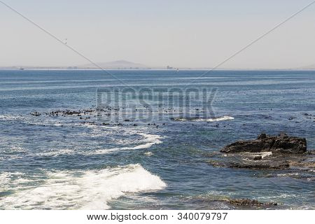 View On Robben Island Seen From The Sea Point Promenade In Cape Town, South Africa.