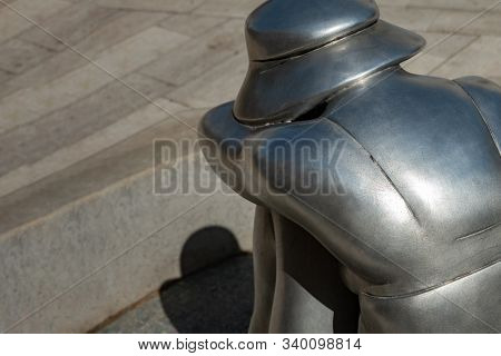 Porec, Croatia, August 19, 2019: A Fragment Of A Bronze Figure Of A Buxom Woman In A Swimsuit And A 