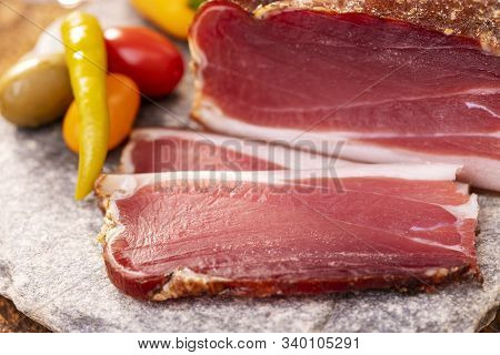 Closeup Of South Tyrolean Speck On Granite