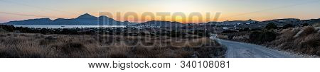 Panorama Of Sunset With Adamas Village And Mountains