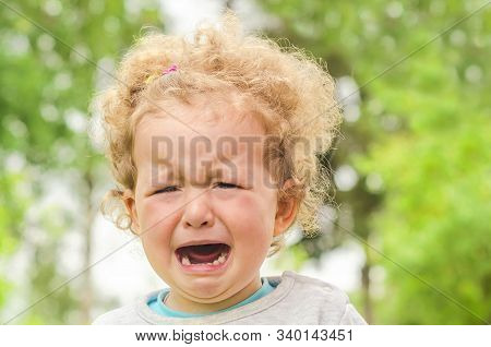 Little Amirican Girl Crying Lost In The Park On The Nature. Offend The Child. Childrens Tears, Moods