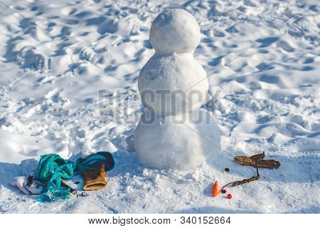 Making Snowman And Winter Fun. New Year Christmas Concept. Making Snowman Outdoor - Copy Space