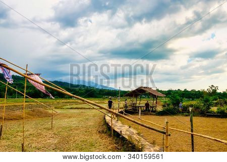 Thai Bamboo Walking Path And Bridge With Beautiful Sky And Forrest Background