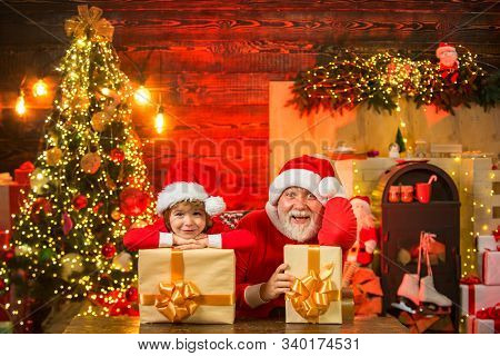 Santa Helper With A Huge Bag. Family Holiday. Little Santa Huge Bag Run To Delivery Christmas Gift. 