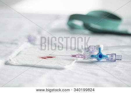 Freshly Placed Intravenous Dropper With Blood Drops