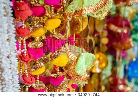 Colorful Fabric Decorations On Display For Sale In Chandi Chowk Old Delhi. These Flowers, Beads And 