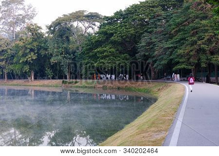 Buddhist Monk And People Walking For Mindfulness Meditation