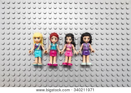 Kouvola, Finland - 18 December 2019: Lego Friends Minifigures On Gray Baseplate