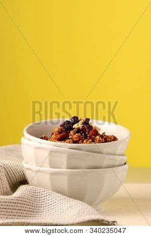 Healthy Breakfast Granola In Bright Yellow Background