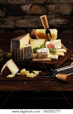 Different Sorts Of Cheese. Cheese Platter With Different Cheese And Spice