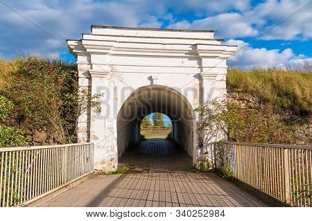 Ravelin Gate Between Stone Walls And Wooden Bridge In Sunny Day, Annenkrone, Vyborg, Leningrad Oblas