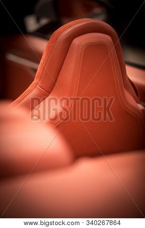 Close Up Shot Of The Leather Headrest Of A Seat In A Modern Luxury Car.