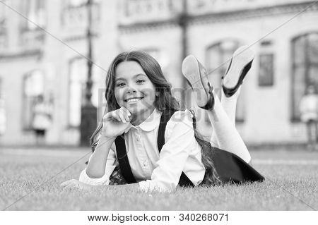 Its That Time Of Year Again. Relaxed Schoolchild. Happy Schoolchild Relax On Green Grass. Small Scho