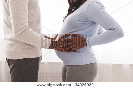 Afro Man Toucing His Pregnant Wife Belly Over Home Window Background, Close Up, Love, Family, Pregna
