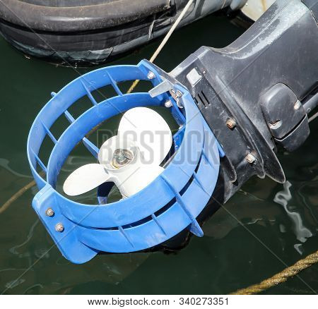 A Propeller Of A Motorboat Looks Out Of The Water