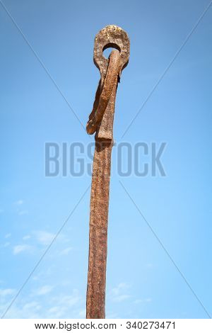Mystical Rusty Rods With A Ring And Eyelet