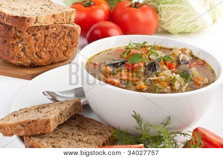 serving of cabbage and mushroom soup with ingredients