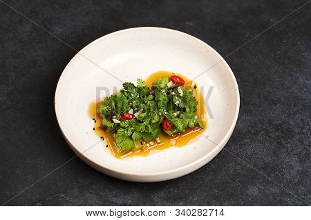 Smashed Cucumbers Plate With Red Chili Pepper Garlic Parsley And Vegetable Oil