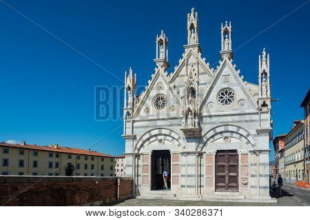 Pisa, Italy - June 6, 2019 : Santa Maria della Spina is a small white marble church alongside the Arno, attributed to Lupo di Francesco (1230). It is another excellent Gothic building.
