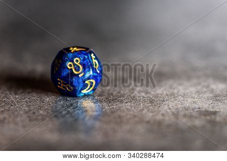 Blue Astrology Dice With Symbol Of Ketu On Dark Grey Background