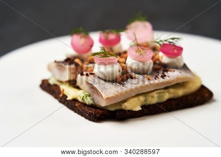 Smorrebrod With Baltic Herring Fish, Smoked Mousse And Pickled Onions