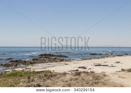 View On Robben Island Seen From The Sea Point Promenade In Cape Town, South Africa.