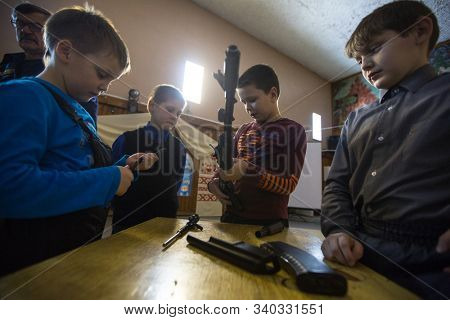 NIKOLSKY, RUSSIA - JAN 19, 2018: Training of children to use weapons in the framework of revival program of the Cossacks in the Leningrad region. Cossacks in St.Petersburg began its revival in 1990.