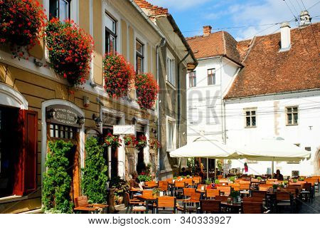 CLUJ NAPOCA, 26 SEPTEMBER 2019: A typical street view in the old center of Cluj Napoca, Romania                               
