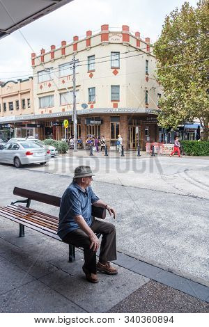 Sydney, Australia - March 26th 2013: A Man Sits On A Bench In Randwick. This Is A Suburb Of The City