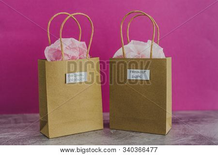 Original Product Vs Dupe Imitation, Shopping Bags With Labels Side By Side With Similar Paper Color