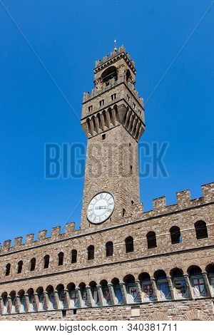 Clock Tower And Embattlements On Palazzo Vecchio In Florence
