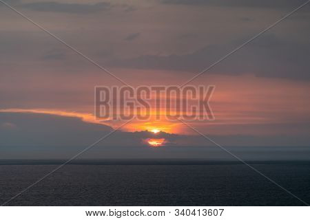 Sunset Over The Indian Ocean In Colombo Sri Lanka, Obscured By Thunderstorm Clouds