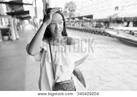 Young Beautiful Tourist Woman Exploring The City Of Bangkok