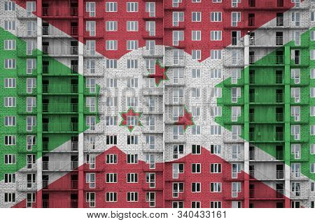 Burundi Flag Depicted In Paint Colors On Multi-storey Residental Building Under Construction. Textur