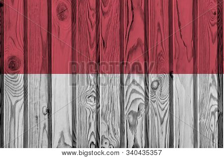 Indonesia Flag Depicted In Bright Paint Colors On Old Wooden Wall. Textured Banner On Rough Backgrou