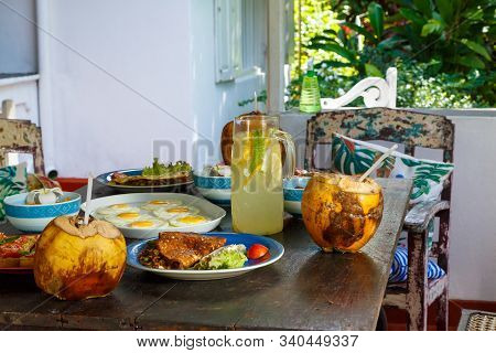 Healthy Breakfast With Cornflakes, Milk And Fresh Berries On Dark Wooden Table, Selective Focus.