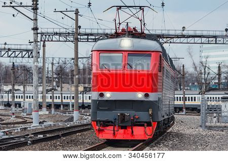 Passenger Locomotive Approaches To The Station Platform At Evening Time.. Mosco. Russia.