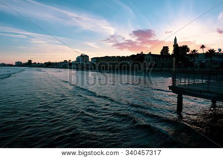 Sunset Over The City Of Larnaca Viewed From The Sea