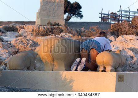 Ayia Napa, Cyprus, August 2019. Sculpture Park, Funny Photo Of A Girl With Hippo Sculptures