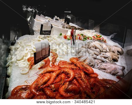 Fishmonger Bar Counter With Shrimps , Octopus And Other Fresh Seafood .