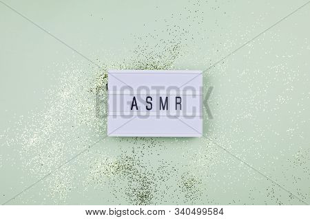 Top View Concept Of Asmr Sound Recordings - Sign On The Mint Table And Gold Glitter Around